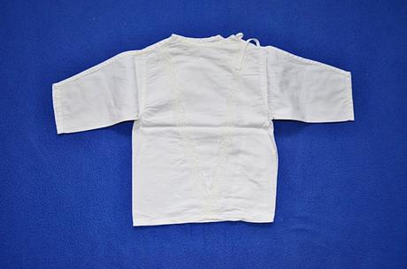 Kojenecká košilka, 62