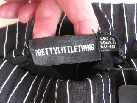 Černé elastické kalhoty s bílými pruhy, 40