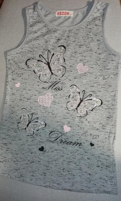 Tílko s motýli, 134