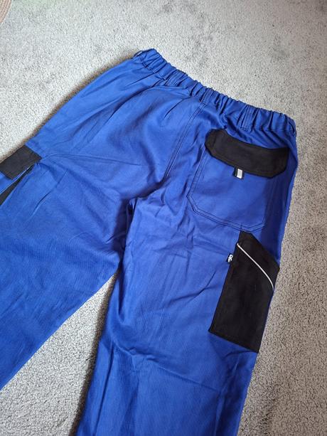 Dvoje bavlněné pracovní kalhoty, xl