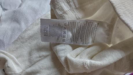 Krémové punčocháče se stříbrnými puntíky., 110