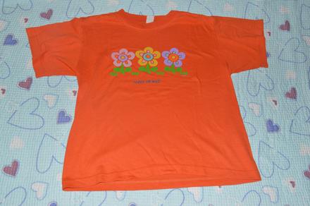 Oranžové tričko s kytkama, 134