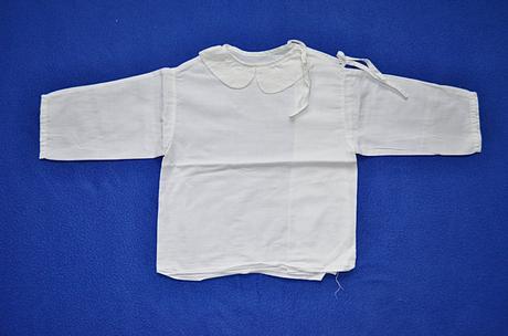 Kojenecká košilka, 62