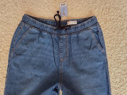 Nenošené světlejší pánské džíny "jogger", 52