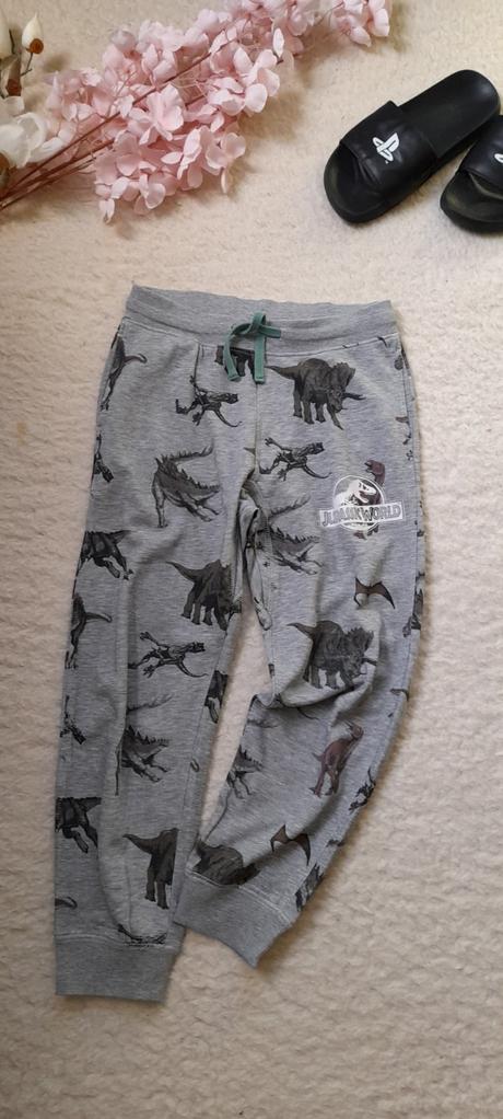 Šedé melírové tepláky jurassic world, h&m,140