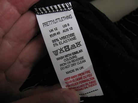 Černé elastické kalhoty s bílými pruhy, 40