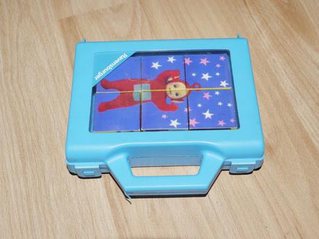 Maly kufrik s kostickami-puzzle-kosticky- na cesty,