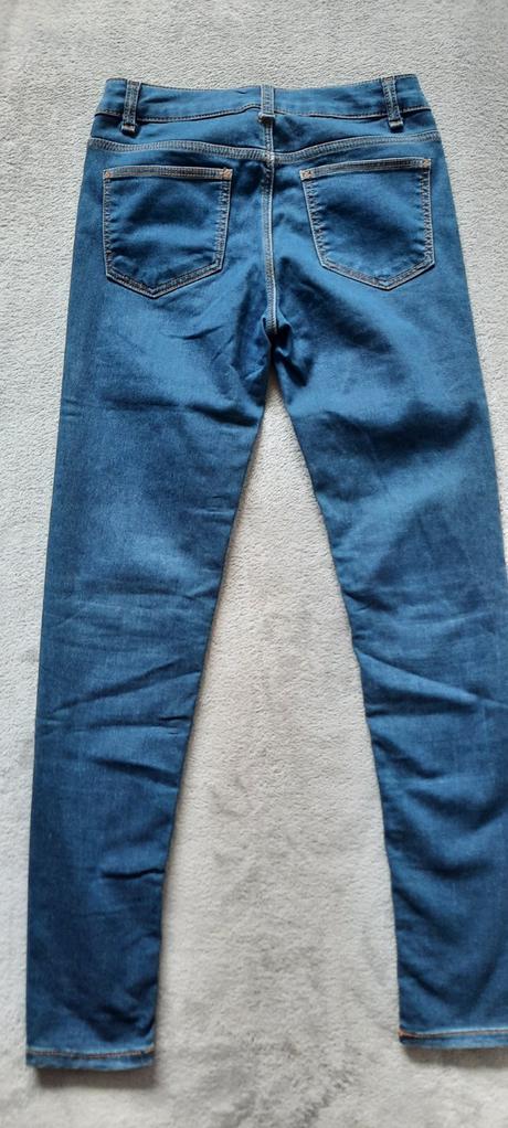 Džíny s oranžovým prošíváním a regulací šírky, 164