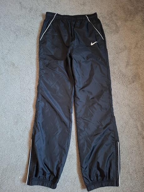Šusťákové kalhoty, nike,164