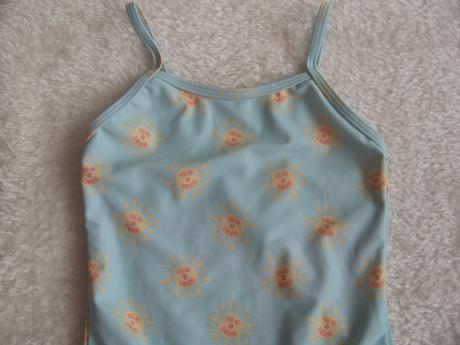 Tyrkysové plavky se sluníčky a s volánky v.4-5 let, primark,110