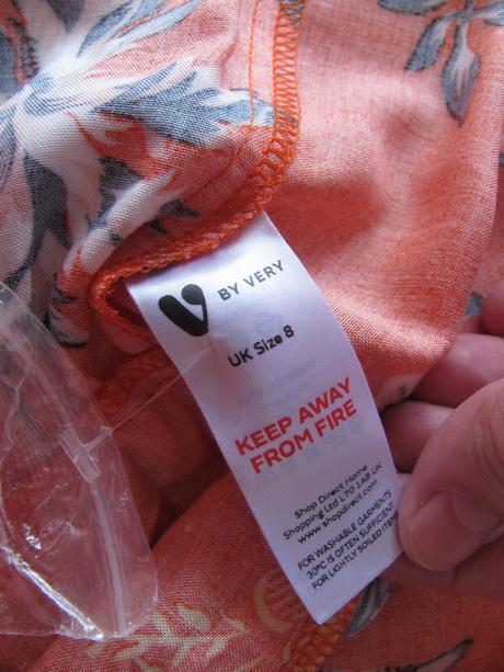 Oranžová letní mini sukně s květy a volánky, 36