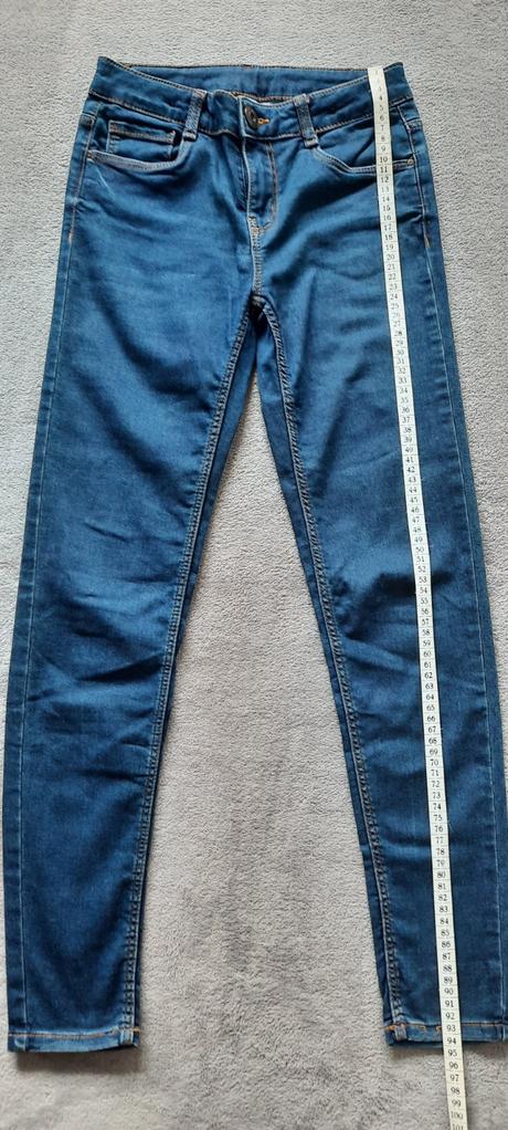 Džíny s oranžovým prošíváním a regulací šírky, 164