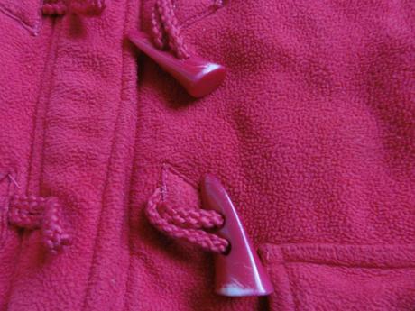 Růžová kabátek, 98