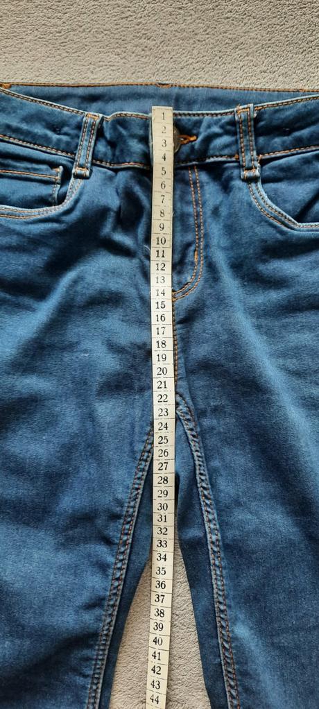 Džíny s oranžovým prošíváním a regulací šírky, 164