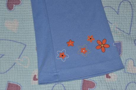 Slabší tepláčky s kytkama, 128