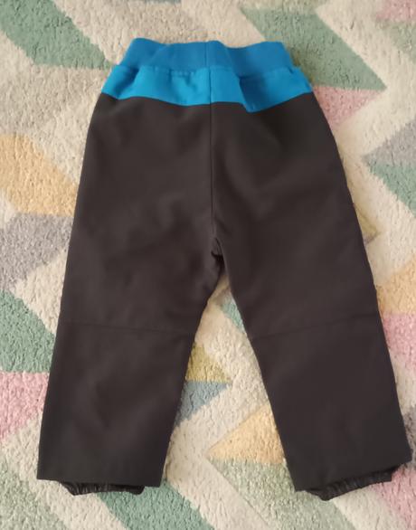 Jarní softshellové kalhoty s bagrem vel.86, kugo,86