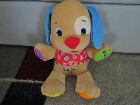 Hrací pejsek zn.fisher price, 