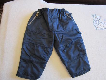 Pěkné tm. modré oteplené šusťákové kalhoty, v.80, dimo,80