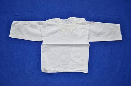 Kojenecká košilka, 56