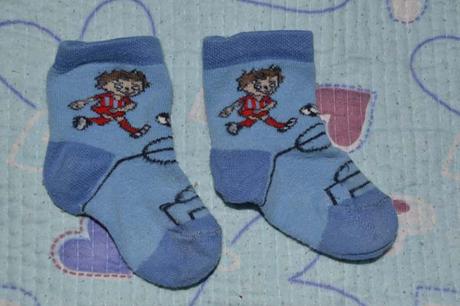 Modré ponožky s fotbalistou, 74