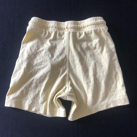 Vel. 116 žluté tenké šortky s kapsami a tkanicí, 116