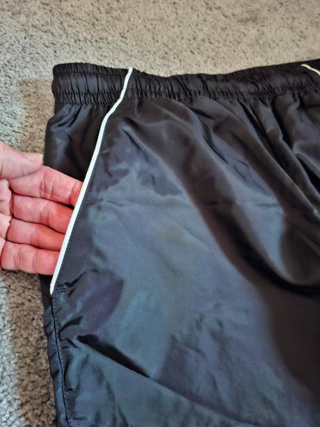 Šusťákové kalhoty, nike,164