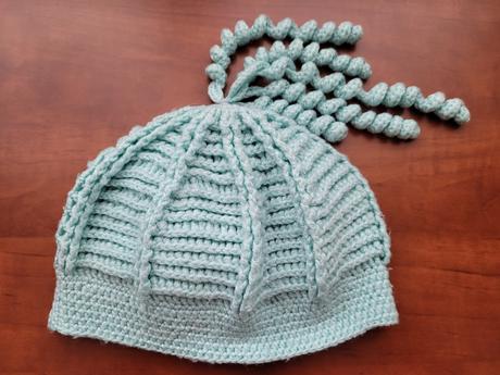 Zelinkavá čepice, 110