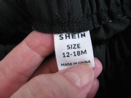 Černé pružné kalhoty, kapsáče, v pase do gumy, 86